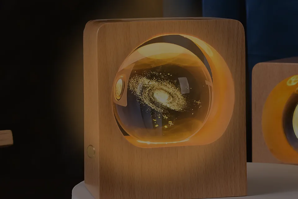 Cauora Crystal Ball Glow Lamp glowing on a nightstand at night