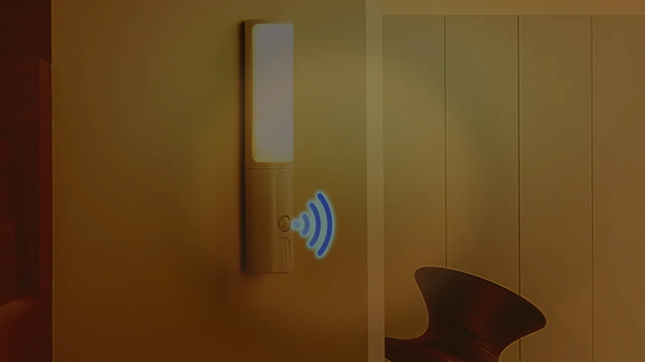 Cauora motion sensor night light glowing on a hallway wall